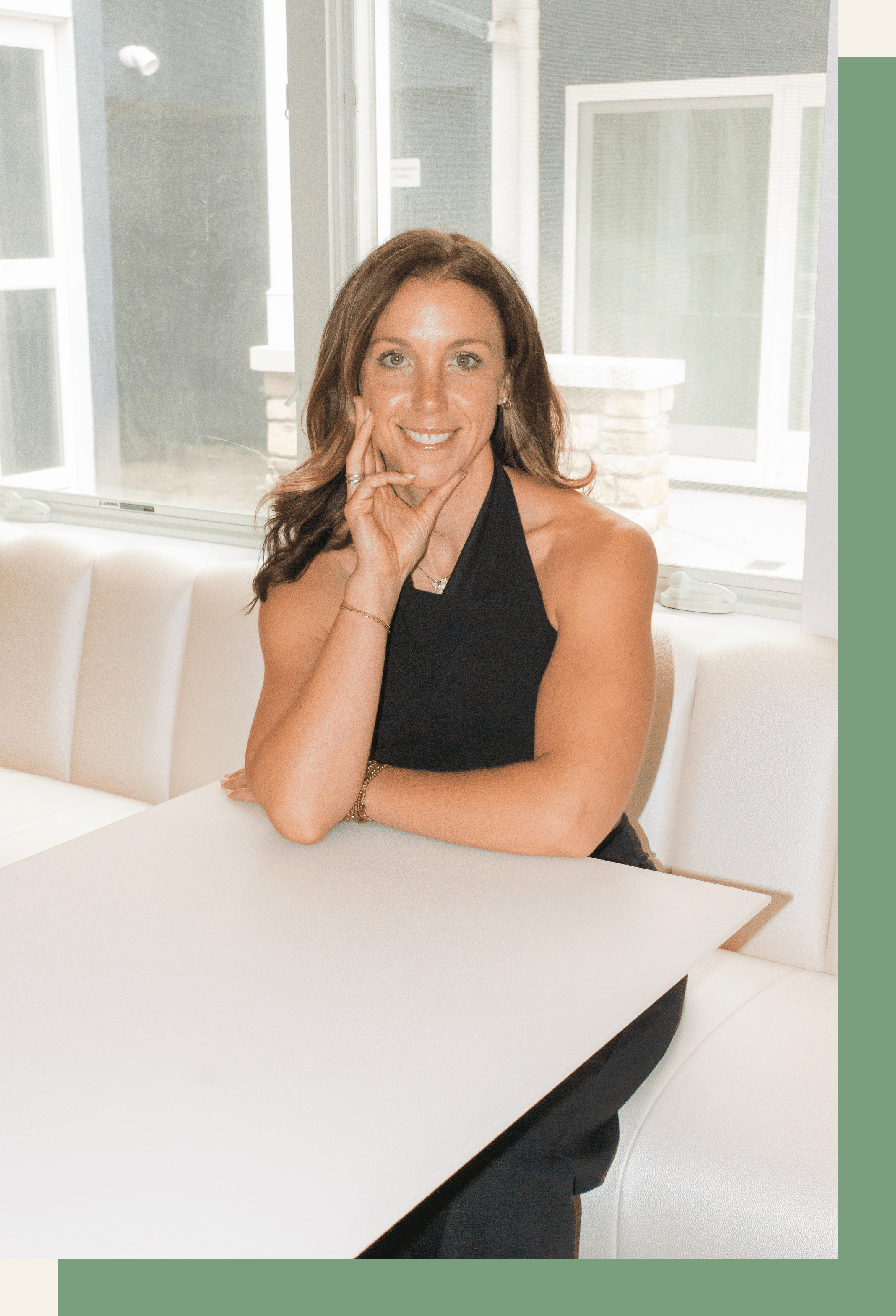 Ali Lacroix, fertility coach for teachers, seated at a sunlit table